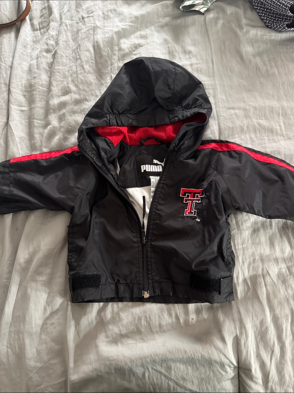 Puma Kids Black Hooded Raincoat with Red Trim and TT Logo TEXAS TECH
